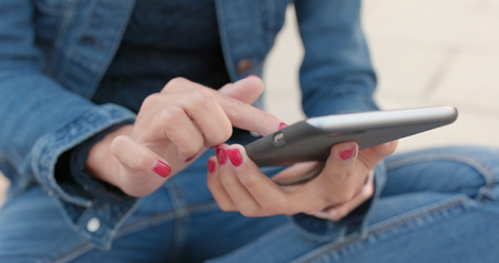 Close up of woman use of mobile phoneの写真素材