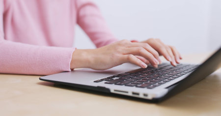 Woman working on laptop computer