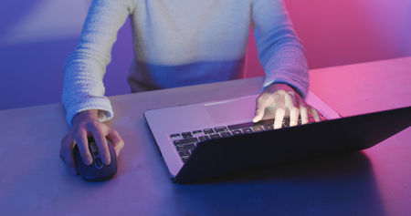 Woman use of notebook computer with cyber modern light