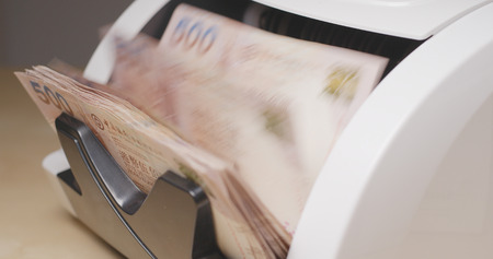 Banknote bill counting on machineの写真素材
