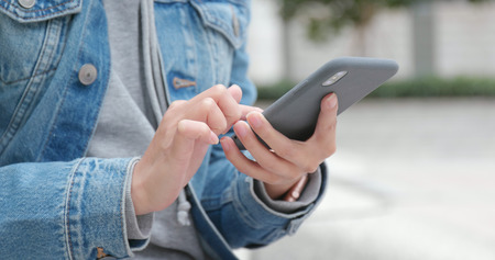 Close up of using smart phoneの写真素材