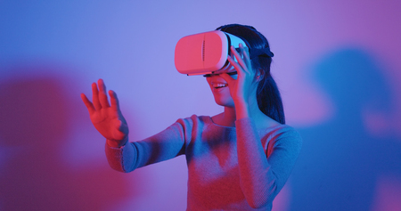 Woman watching with VR deviceの写真素材