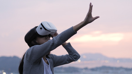 Woman watching with virtual reality deviceの写真素材