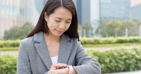 Young business woman use of smart watchの写真素材