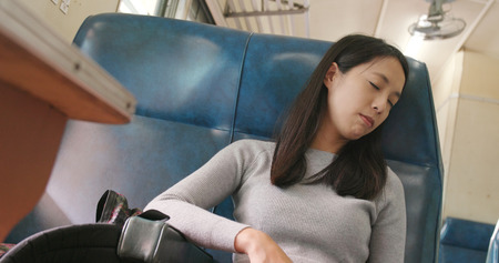 Travel woman sitting on the trainの写真素材