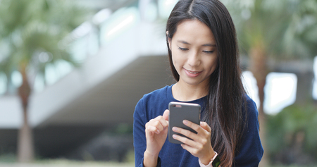 Woman use of mobile phoneの写真素材