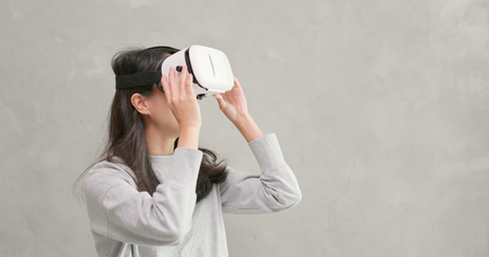 Woman watching with VR deviceの写真素材