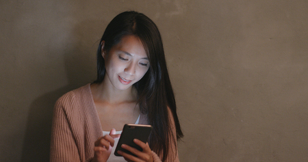 Woman using cellphoneの写真素材