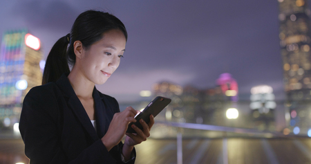 Business woman use of cellphone in Hong Kongの写真素材