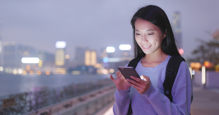 Women using smart phone at outdoorの写真素材