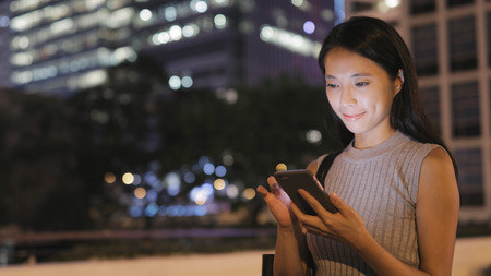 Woman text on cellphoneの写真素材