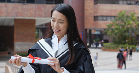 Happy cheerful woman get graduationの写真素材