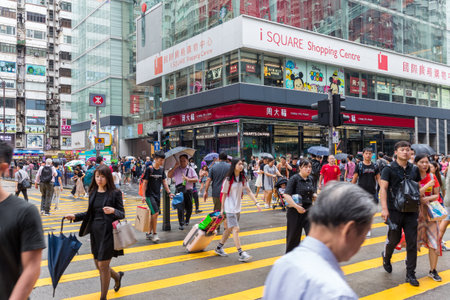 Tsim Sha Tsui, Hong Kong 17 August 2018:- People walking though the road in rain dayのeditorial素材
