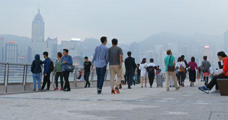 Tsim Sha Tsui, Hong Kong, 27 February 2019: People walk in the streetのeditorial素材