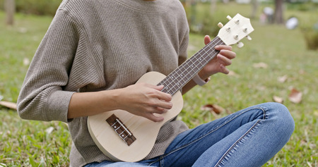 Woman playing ukulele