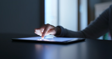 Woman using tablet computer