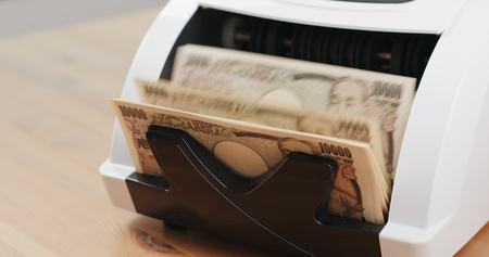 Japanese banknote on Money counting machineの写真素材