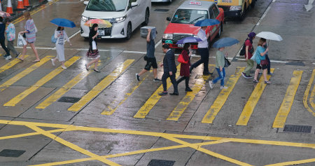 Central, hong Kong, 10 October 2018:- Top view of People cross the street in city at rain day