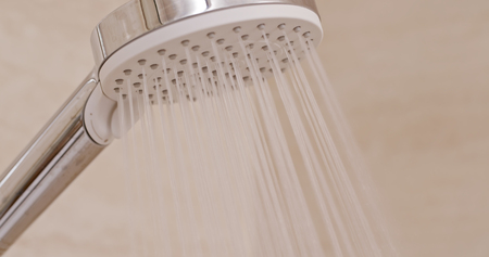 Turning on the showerの写真素材
