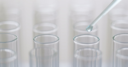 Drop blue liquid in test tubesの写真素材