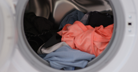 Load clothes to washer machineの写真素材