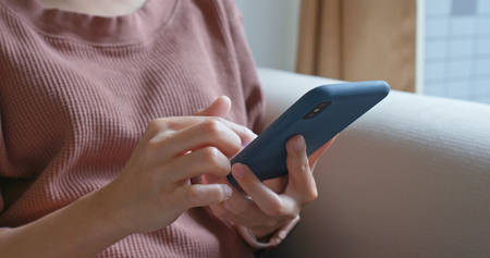 Close up of woman use of mobile phoneの写真素材