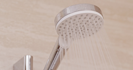Turning on the showerの写真素材