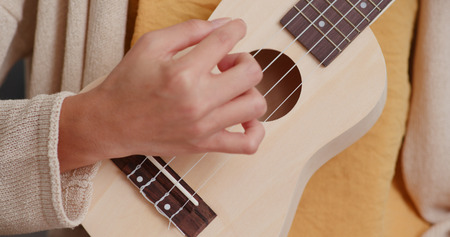 Woman play ukuleleの写真素材