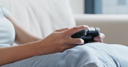 Woman play tv game at home