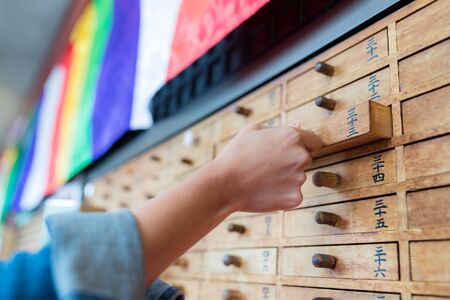 Paper Fortune in a drawer at Sensoji Asakusa Templeの写真素材