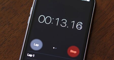 Numerical digital stopwatch with white number and black screen on cellphone