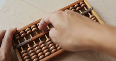 Use of abacus for calculationの写真素材