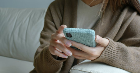 Woman touch on the phone at home