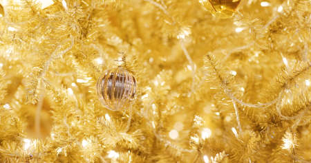 Christmas tree decoration in gold colorの写真素材