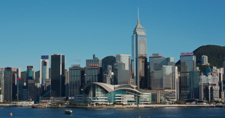 Victoria Harbor, Hong Kong, 22 July 2020: Hong Kong with blue sky