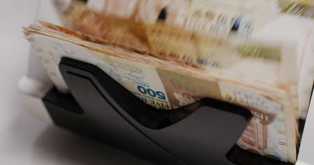 Electronic money counter machine count Hong Kong banknoteの写真素材