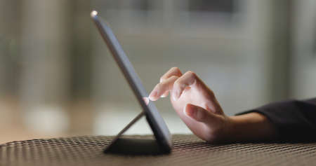 Working on digital tablet computerの写真素材