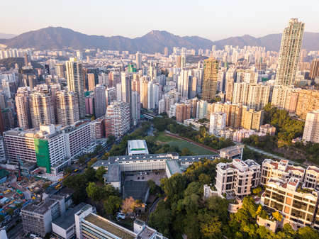 Top view of Hong Kong city under sunsetの写真素材