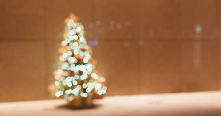 Window reflection of Christmas tree decoration at nightの写真素材