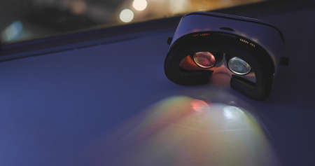 VR device playing video inside at nightの写真素材