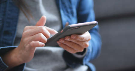Woman finger touch on cellphone