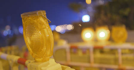 Caution sign is lit up in the cityの写真素材