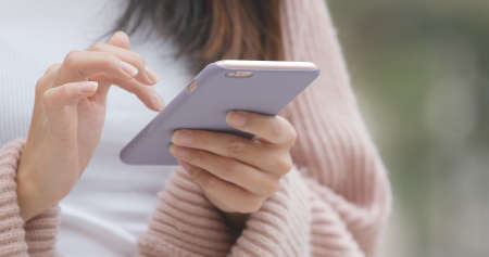 Using mobile phone close upの写真素材