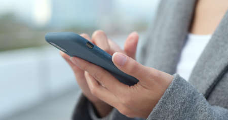 Business woman use of mobile phone at outdoor