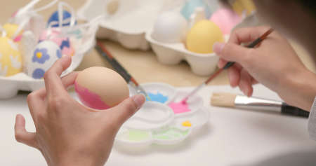 Painting colorful Easter eggの写真素材