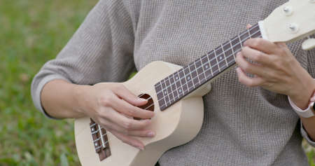 Woman play ukuleleの写真素材