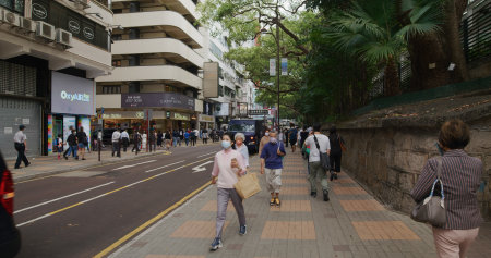 Tsim Sha Tsui, Hong Kong 17 April 2021: First personal view of people walk at the city streetのeditorial素材