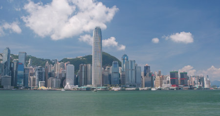 Victoria Harbour, Hong Kong 13 April 2018:- Hong Kong urban city skyline in sunny day