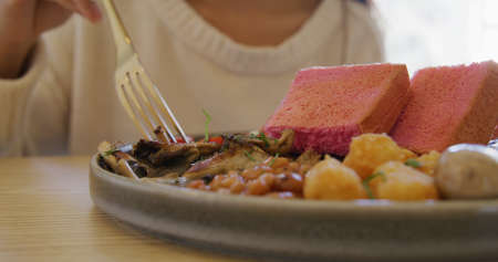 Woman enjoy her dishes in restaurant