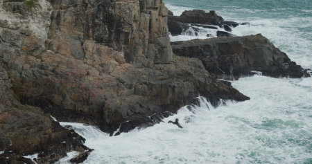 Sea wave splash on the rockの写真素材